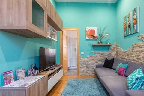 Exclusive Condo | Living area | 25-inch LCD TV with premium channels, TV