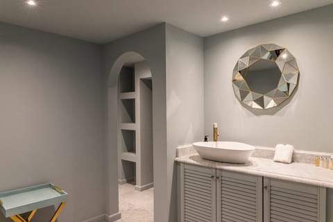 Luxury Room | Bathroom | Rainfall showerhead, designer toiletries, hair dryer, bathrobes