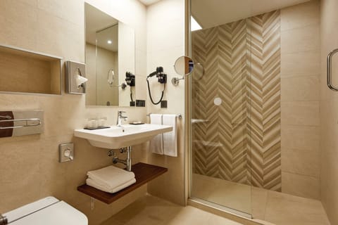 Shower, eco-friendly toiletries, hair dryer, towels