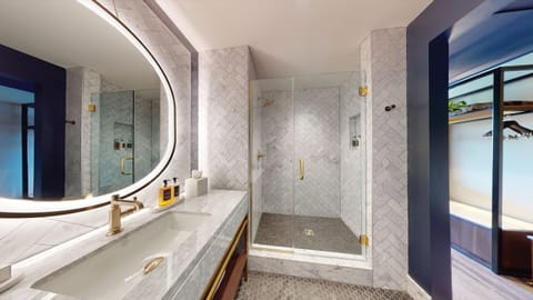 Designer toiletries, hair dryer, bathrobes, slippers