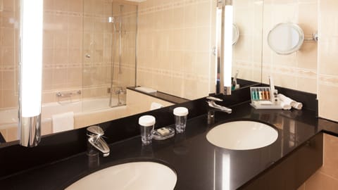 Junior Suite, 1 Queen Bed | Bathroom | Rainfall showerhead, eco-friendly toiletries, hair dryer, bathrobes