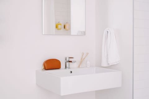 Studio, 1 King Bed | Bathroom | Designer toiletries, hair dryer, towels, soap