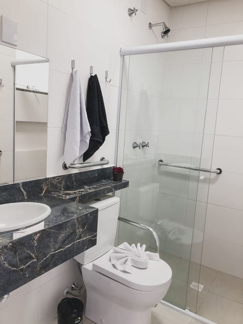 Exclusive Triple Room | Bathroom | Shower, hair dryer, towels, soap