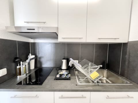 Standard Apartment | Private kitchen | Full-size fridge, microwave, toaster, cookware/dishes/utensils