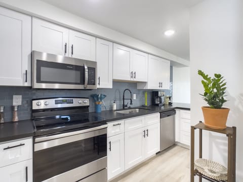 Design Apartment | Private kitchen | Full-size fridge, microwave, oven, stovetop