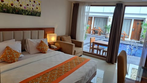 Deluxe Room, Pool Access | In-room safe, soundproofing, iron/ironing board, rollaway beds