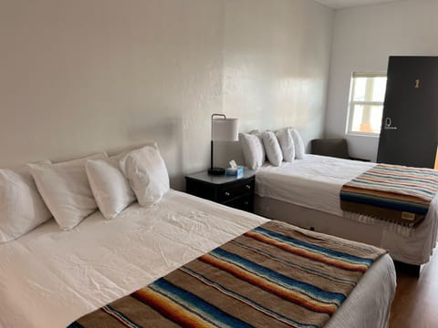 Double Room, Multiple Beds, Kitchenette | Blackout drapes, free WiFi, bed sheets