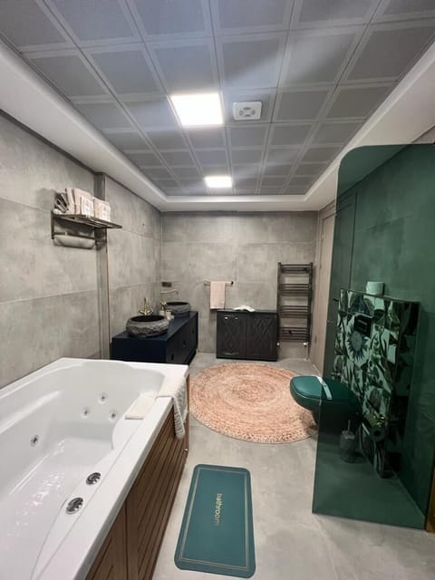 Exclusive Villa | Bathroom | Shower, hydromassage showerhead, hair dryer, slippers