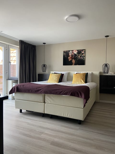 Deluxe Suite, Terrace | Memory foam beds, in-room safe, blackout drapes, iron/ironing board