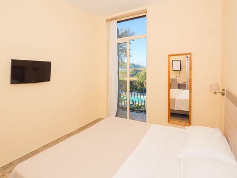 Superior Double or Twin Room, Pool View | In-room safe, desk, iron/ironing board, travel crib