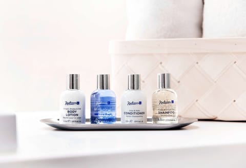 Eco-friendly toiletries, hair dryer, towels