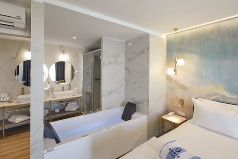 Luxury Suite | Bathroom | Designer toiletries, hair dryer, slippers, bidet