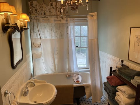 Combined shower/tub, deep soaking tub, hair dryer, bathrobes