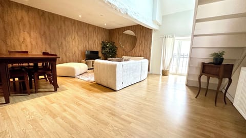 Design Duplex | Living area | 82-inch flat-screen TV with digital channels