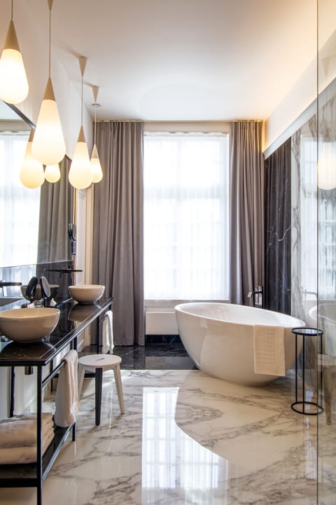 Luxury Suite | Bathroom | Designer toiletries, hair dryer, bathrobes, slippers