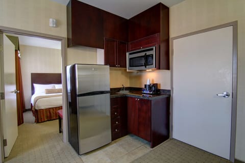 Suite, 1 King Bed, Non Smoking, Kitchenette | 1 bedroom, desk, laptop workspace, iron/ironing board