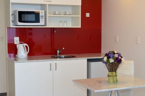 Junior Suite | Private kitchen | Fridge, microwave, coffee/tea maker, cookware/dishes/utensils