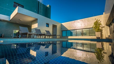 Outdoor pool, pool umbrellas, sun loungers