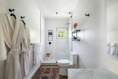 Shower, designer toiletries, hair dryer, bathrobes