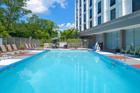 Seasonal outdoor pool, open 10:00 AM to 8:00 PM, pool umbrellas