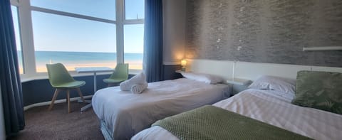 Family Room, Sea View (2 adults + 2 children) | Iron/ironing board, free WiFi, bed sheets