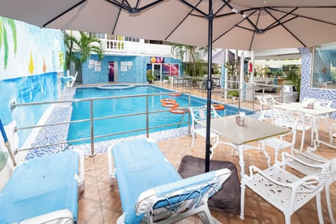 Indoor pool, outdoor pool, open 7 AM to 7 PM, pool umbrellas