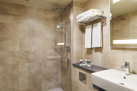 Shower, eco-friendly toiletries, hair dryer, towels