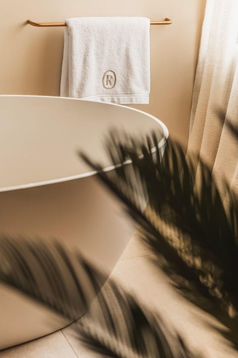 Designer toiletries, hair dryer, towels