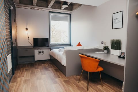 Economy Room | Blackout drapes, free WiFi, bed sheets