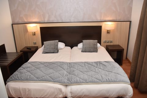 Twin Room | Blackout drapes, iron/ironing board, free WiFi