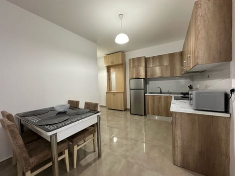 Panoramic Apartment | Private kitchen | Electric kettle, eco-friendly cleaning products