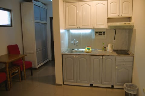 Apartment | Private kitchen | Mini-fridge, stovetop, cookware/dishes/utensils, spices