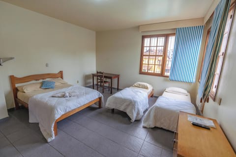 Deluxe Quadruple Room | Desk, laptop workspace, free WiFi, bed sheets