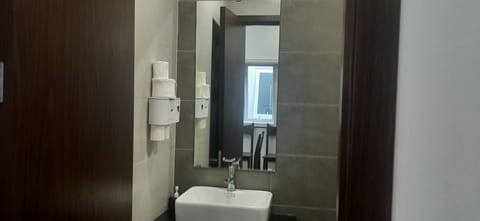 Studio Suite | Bathroom | Shower, bidet, towels, toilet paper