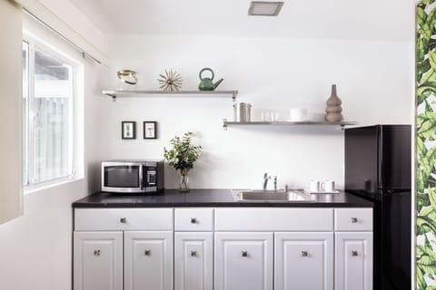 Deluxe Double Room, 1 King and 1 Queen | Private kitchenette | Fridge, coffee/tea maker