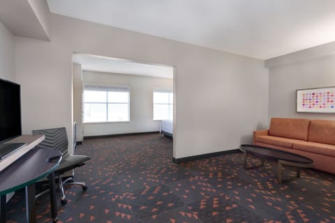 Suite, 1 Bedroom | Desk, blackout drapes, iron/ironing board, free cribs/infant beds