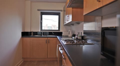 Apartment | Private kitchen | Microwave, electric kettle, toaster, cookware/dishes/utensils