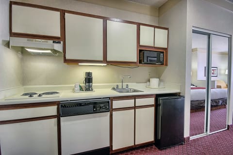 Suite, 1 King Bed, Non Smoking | Private kitchen | Fridge, microwave, coffee/tea maker, eco-friendly cleaning products