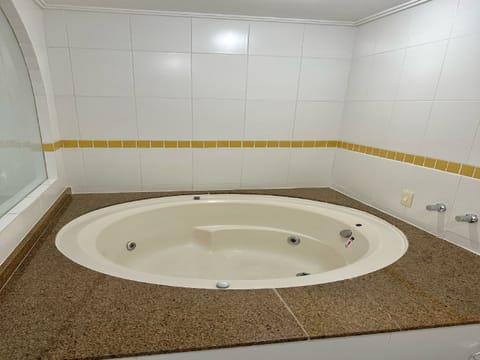 Comfort Apartment | Bathroom | Separate tub and shower, jetted tub, rainfall showerhead, toilet paper