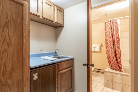 Townhome | Bathroom | Combined shower/tub, hair dryer, towels, soap