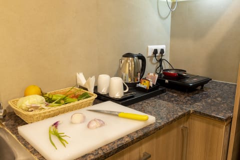 Premium Studio Suite, 1 Bedroom, City View | Private kitchen | Mini-fridge, microwave, coffee/tea maker, electric kettle