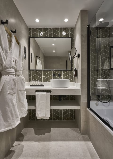 Luxe Essence | Bathroom | Eco-friendly toiletries, hair dryer, towels