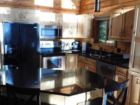 Cabin, Multiple Beds, Kitchen | Private kitchen | Fridge, microwave, oven, stovetop