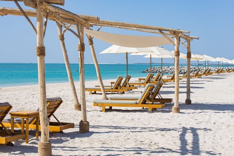 Private beach, white sand, free beach cabanas, sun loungers