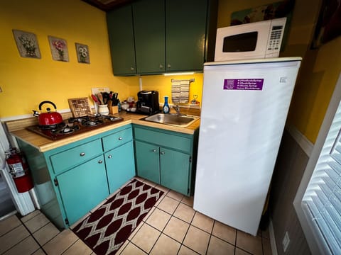 Deluxe Cottage, 1 bedroom (Cookie's Kitchen Cottage) | Private kitchenette | Fridge, microwave, coffee/tea maker, cleaning supplies