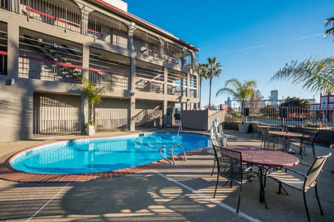 Seasonal outdoor pool, open 9:00 AM to 10:00 PM, pool umbrellas