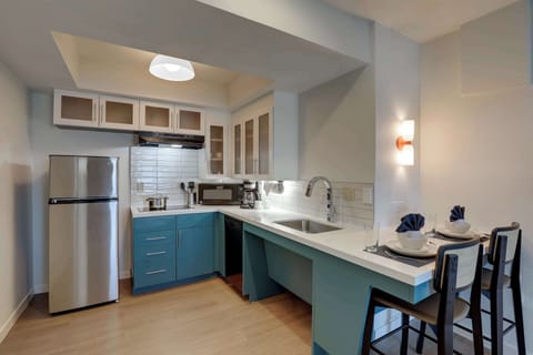 Suite, 1 Queen Bed, Accessible (Mobility Tub One Bedroom) | Private kitchenette | Full-size fridge, microwave, stovetop, dishwasher