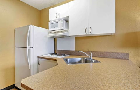 Studio, 1 Queen Bed, Non Smoking | Private kitchen | Full-size fridge, microwave, stovetop