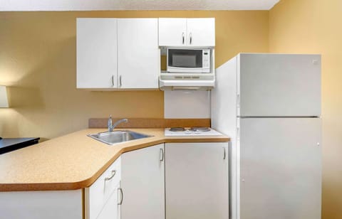 Studio, 1 King Bed, Non Smoking | Private kitchen | Full-size fridge, microwave, stovetop