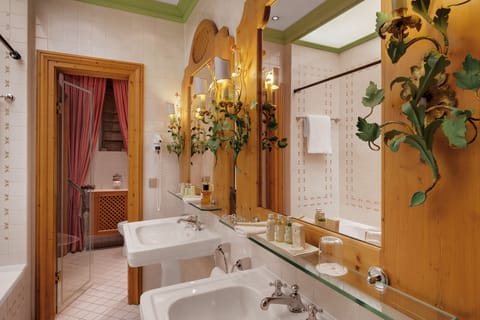 Combined shower/tub, designer toiletries, hair dryer, bathrobes